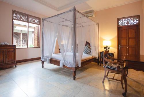 Imagen de la habitación del Hotel Honeymoon Guesthouse. Foto 9