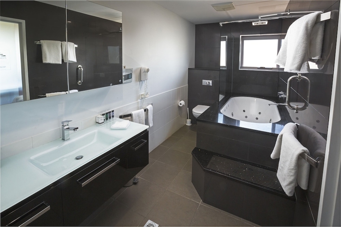 Imagen de la habitación del Hotel Honeysuckle Executive Apartments. Foto 8