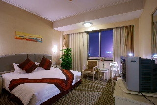 Imagen de la habitación del Hotel Hong Li. Foto 4