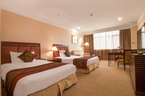 Imagen de la habitación del Hotel Hongguang Hotel Wuhan. Foto 2