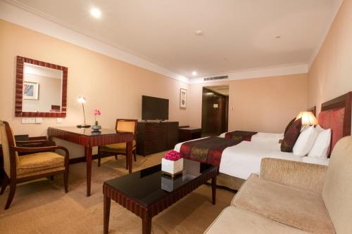 Imagen de la habitación del Hotel Hongguang Hotel Wuhan. Foto 6