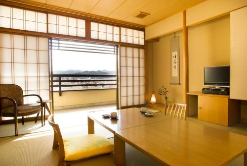 Imagen de la habitación del Hotel Honjin Hiranoya Kofukan. Foto 7