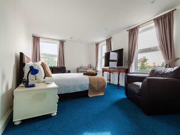 Imagen de la habitación del Hotel Hookwood Lodge. Foto 5