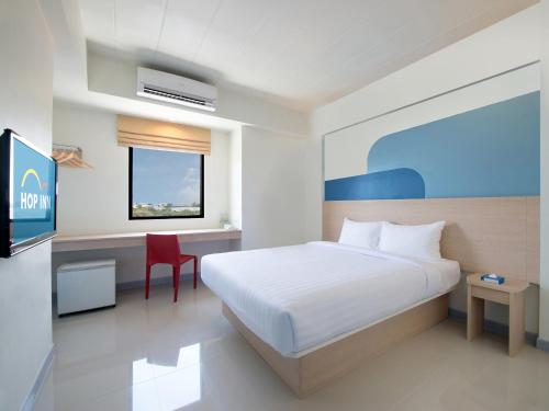 Imagen de la habitación del Hotel Hop Inn Suphanburi. Foto 17
