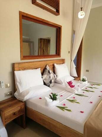 Imagen de la habitación del Hotel Horizon of Michamvi Beach. Foto 17