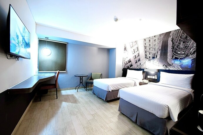 Imagen de la habitación del Hotel Horu Mangga Dua Square. Foto 8