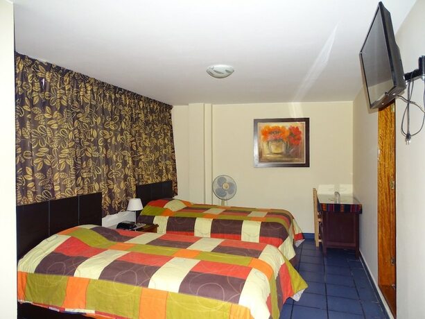 Imagen de la habitación del Hotel Hospedaje Dimar Inn. Foto 25