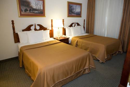 Imagen de la habitación del Hotel Host Inn All Suites. Foto 3