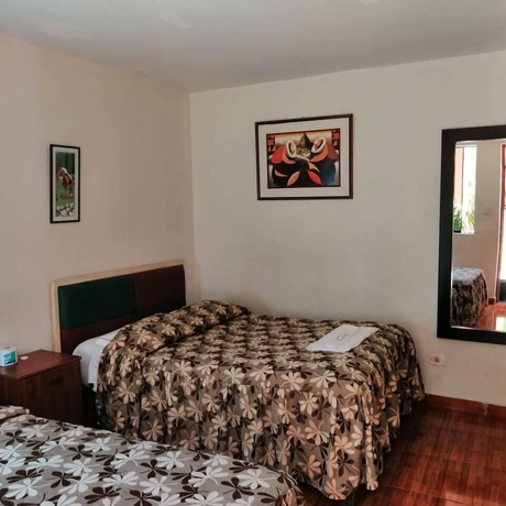 Imagen de la habitación del Hotel Hostal Characato Suite. Foto 4