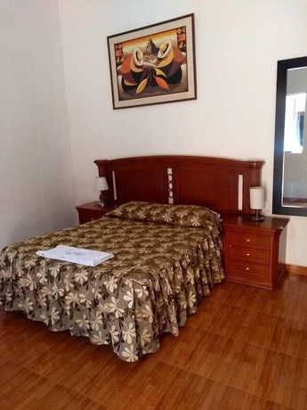 Imagen de la habitación del Hotel Hostal Characato Suite. Foto 10