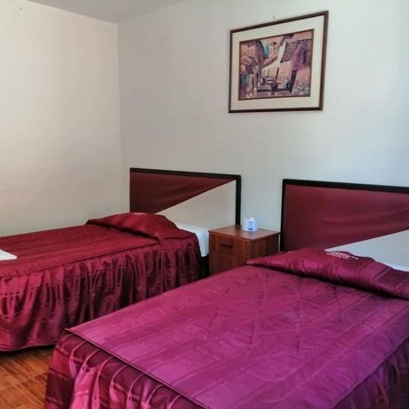 Imagen de la habitación del Hotel Hostal Characato Suite. Foto 12
