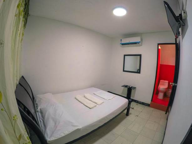 Imagen de la habitación del Hotel Hostal El Exito. Foto 8