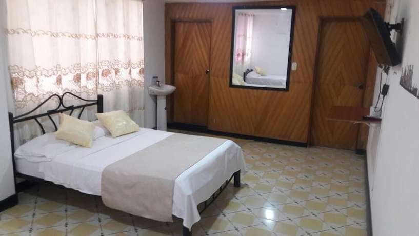 Imagen de la habitación del Hotel Hostal El Exito. Foto 14