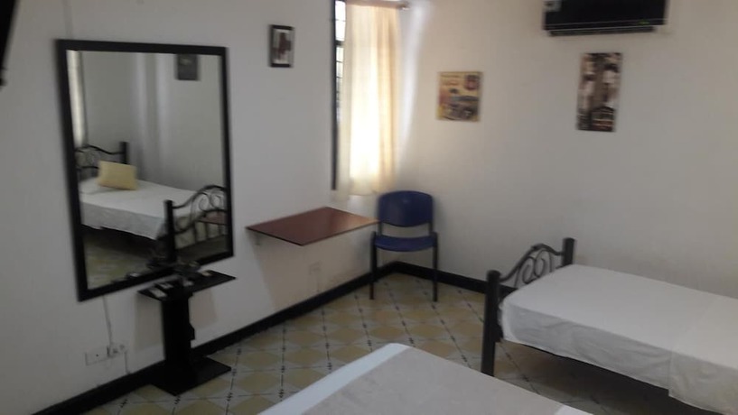Imagen de la habitación del Hotel Hostal El Exito. Foto 15
