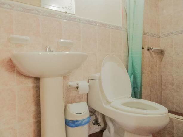 Imagen de la habitación del Hotel Hostal La Rosa Otavalo. Foto 11