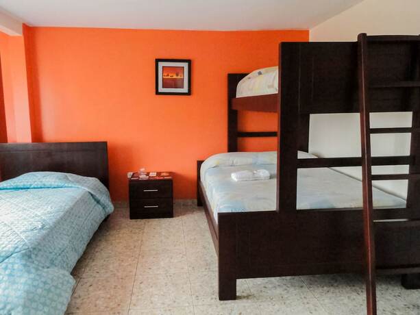 Imagen de la habitación del Hotel Hostal La Rosa Otavalo. Foto 13