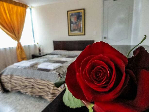 Imagen de la habitación del Hotel Hostal La Rosa Otavalo. Foto 17