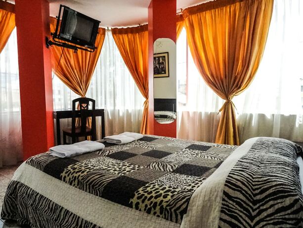 Imagen de la habitación del Hotel Hostal La Rosa Otavalo. Foto 19