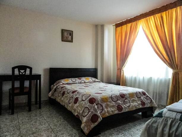 Imagen de la habitación del Hotel Hostal La Rosa Otavalo. Foto 20