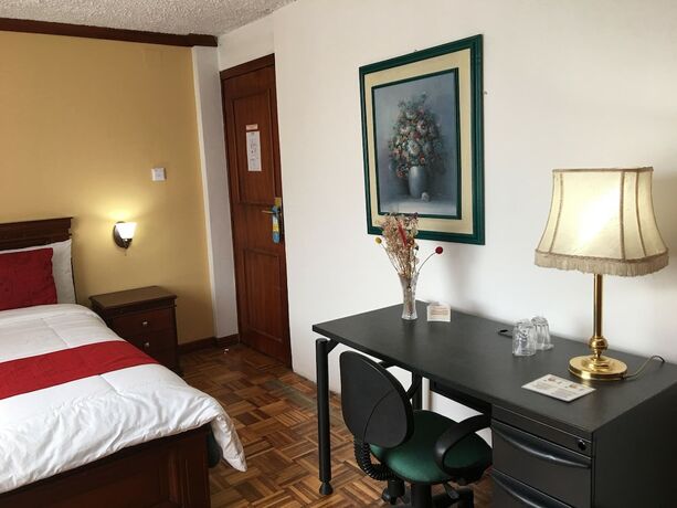 Imagen de la habitación del Hotel Hostal Mitad del Mundo. Foto 11