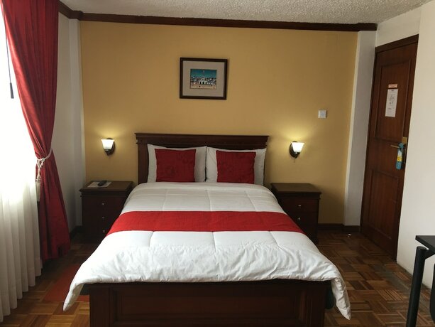 Imagen de la habitación del Hotel Hostal Mitad del Mundo. Foto 19
