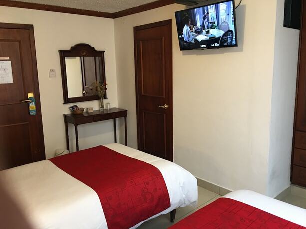 Imagen de la habitación del Hotel Hostal Mitad del Mundo. Foto 20