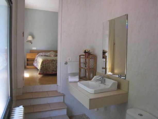 Imagen de la habitación del Hotel Hostal Rural Can Enric. Foto 16