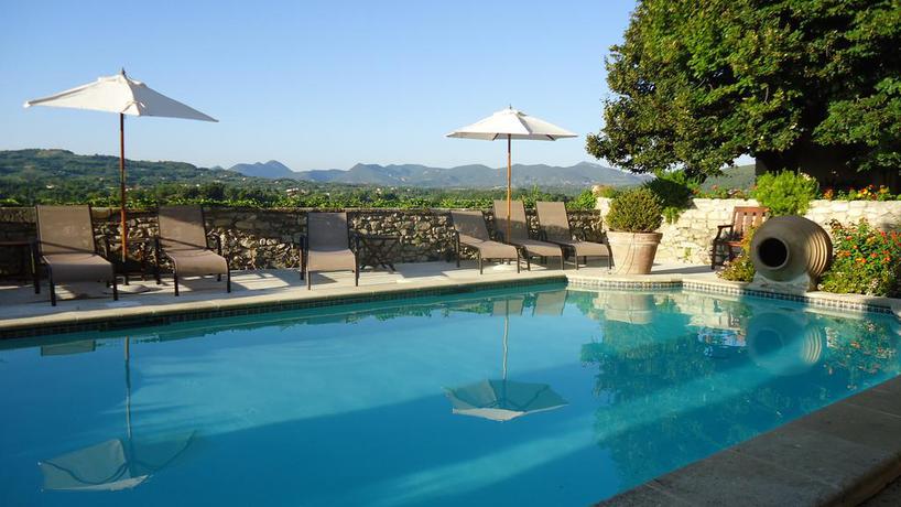 Imagen de la piscina del Hotel Hostellerie Le Beffroi, Vaison-la-Romaine. Foto 9
