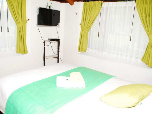 Imagen de la habitación del Hotel Hosteria Airport Garden. Foto 10