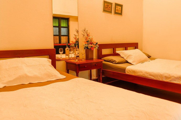 Imagen de la habitación del Hotel Hosteria Colonial La Cueva de Leo. Foto 7