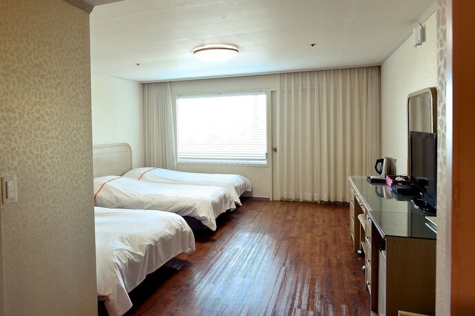 Imagen de la habitación del Hotel Hotel Honey Crown. Foto 14