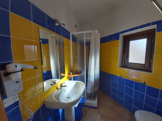 Imagen de la habitación del Hotel Hotel Il Faro di Molara. Foto 11