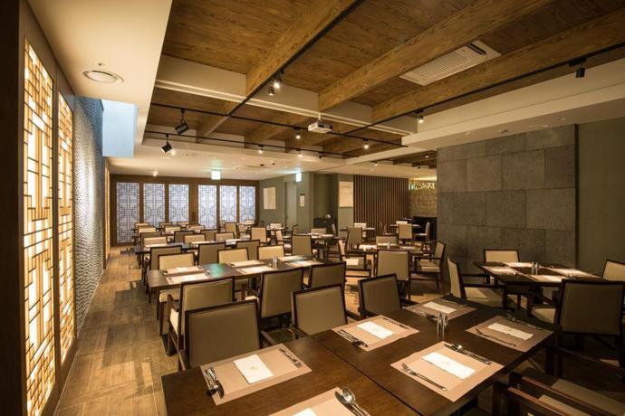 Imagen del bar/restaurante del Hotel Hotel Kennystory Premium Jeju Yeondong. Foto 7