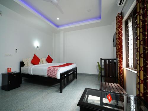 Imagen de la habitación del Hotel Hotel O Aluva Town. Foto 3