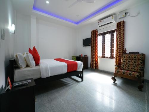 Imagen de la habitación del Hotel Hotel O Aluva Town. Foto 8
