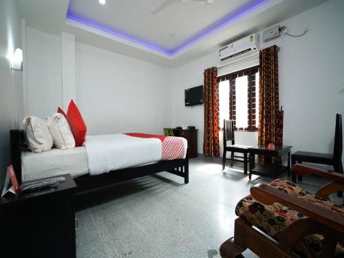 Imagen de la habitación del Hotel Hotel O Aluva Town. Foto 9