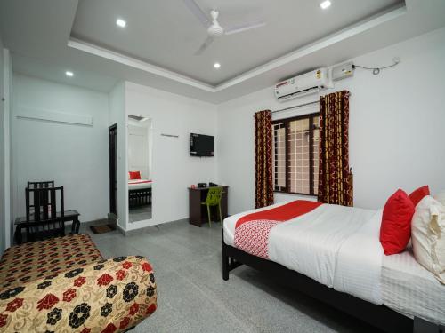 Imagen de la habitación del Hotel Hotel O Aluva Town. Foto 10