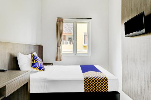 Imagen de la habitación del Hotel Hotel O Cihampelas Near Ciwalk Formerly D'River Guest House. Foto 10