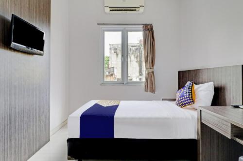 Imagen de la habitación del Hotel Hotel O Cihampelas Near Ciwalk Formerly D'River Guest House. Foto 12