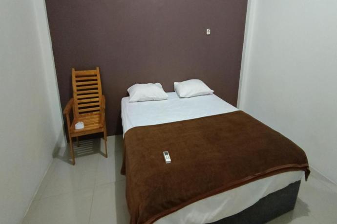 Imagen de la habitación del Hotel Hotel O Fanilly Guest House MarabahanNearJembatan Rumpiang. Foto 4