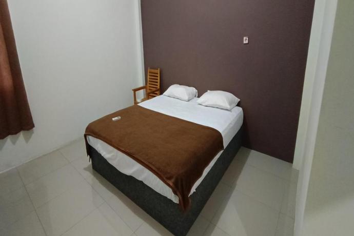 Imagen de la habitación del Hotel Hotel O Fanilly Guest House MarabahanNearJembatan Rumpiang. Foto 5