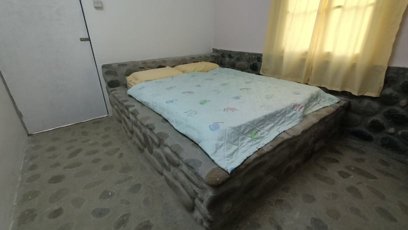 Imagen de la habitación del Hotel Hotel O Flinstone Lodge. Foto 9