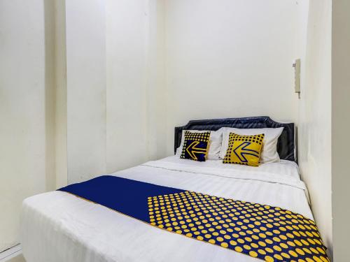 Imagen de la habitación del Hotel Hotel O Gang Tengah Homestay Syariah. Foto 13