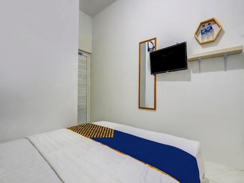 Imagen de la habitación del Hotel Hotel O Gang Tengah Homestay Syariah. Foto 17