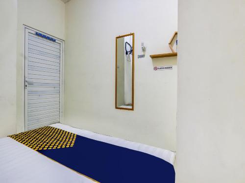 Imagen de la habitación del Hotel Hotel O Gang Tengah Homestay Syariah. Foto 18