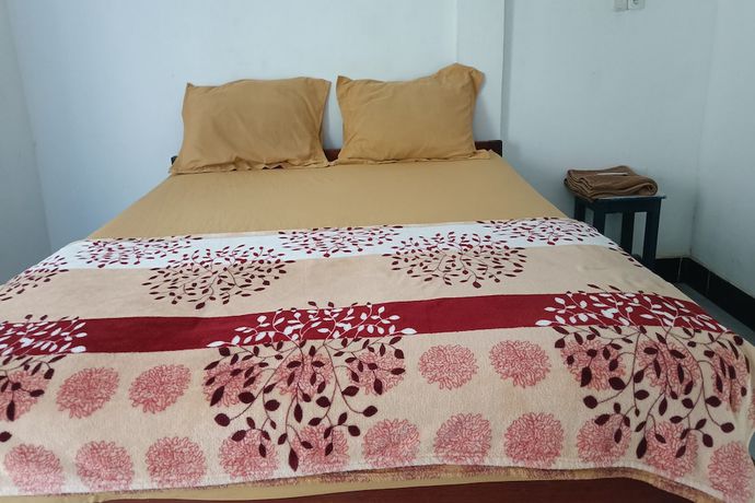 Imagen de la habitación del Hotel Hotel O Kawi Homestay. Foto 7
