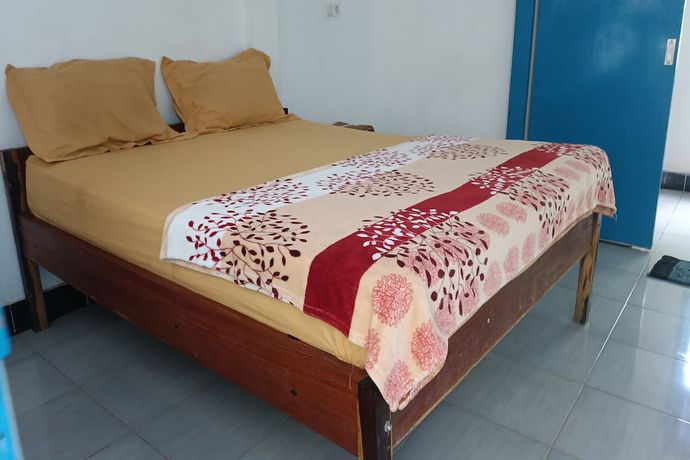 Imagen de la habitación del Hotel Hotel O Kawi Homestay. Foto 10