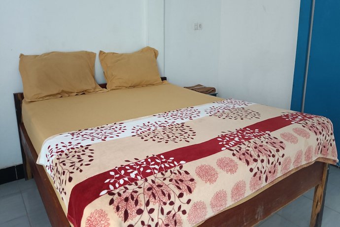 Imagen de la habitación del Hotel Hotel O Kawi Homestay. Foto 12