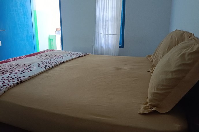 Imagen de la habitación del Hotel Hotel O Kawi Homestay. Foto 16