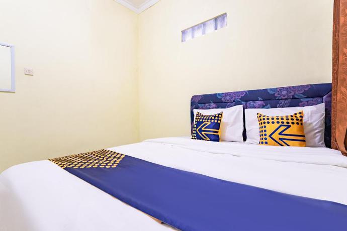 Imagen de la habitación del Hotel Hotel O Nabila Homestay. Foto 11